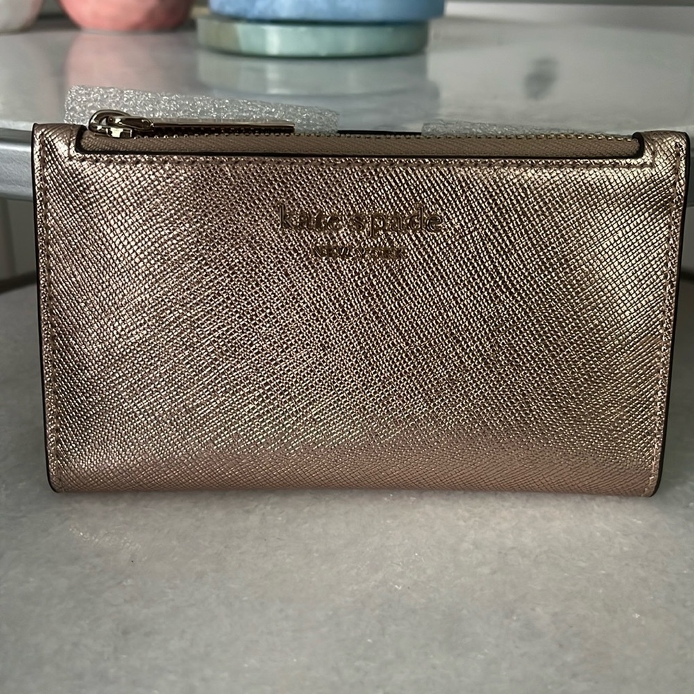 ♠️ Kate Spade New York Spencer Metallic Small Slim Bifold Wallet in Rose Gold